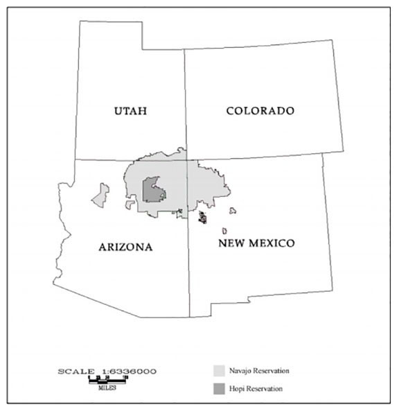 The Navajo Nation, in light gray, sprawls over three states and encircles most of the Hopi reservation, in darker gray.