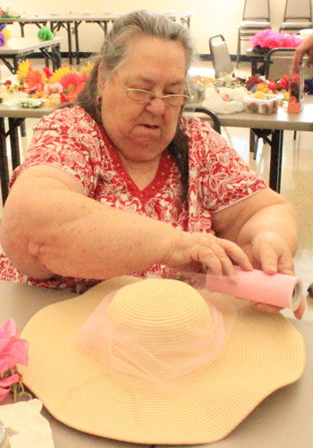 Betty Molina hard at work creating a hat for the Kentucky Derby at Cahill Senior Center, Wednesday, April 20, 2016, in Tempe, Ariz.(JMC Photo/Kendall Bartley)