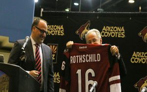 Coyotes President and CEO Anthony LeBlanc (left) poses with Tucson mayor Jonathan Rothschild and his customized Coyotes jersey. (Photo by Joseph Steen/Cronkite News)