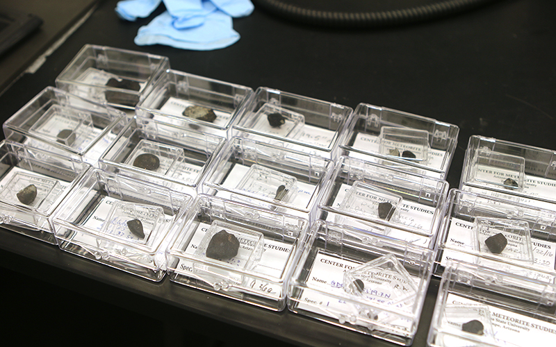 The fifteen meteorites recovered from the White Mountain Apache tribal lands. (Photo by Anna Copper/Cronkite News)