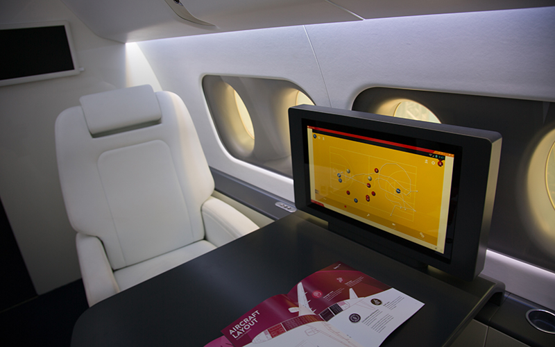 The Sukhoi SportJet features a table and monitor where team coaches can sit and share plays, strategies and team footage with the athletes. A full-scale model of the plane's interior was on display at the Marimbas Club in Rio de Janeiro. (Photo by Graham Bosch/Cronkite News)