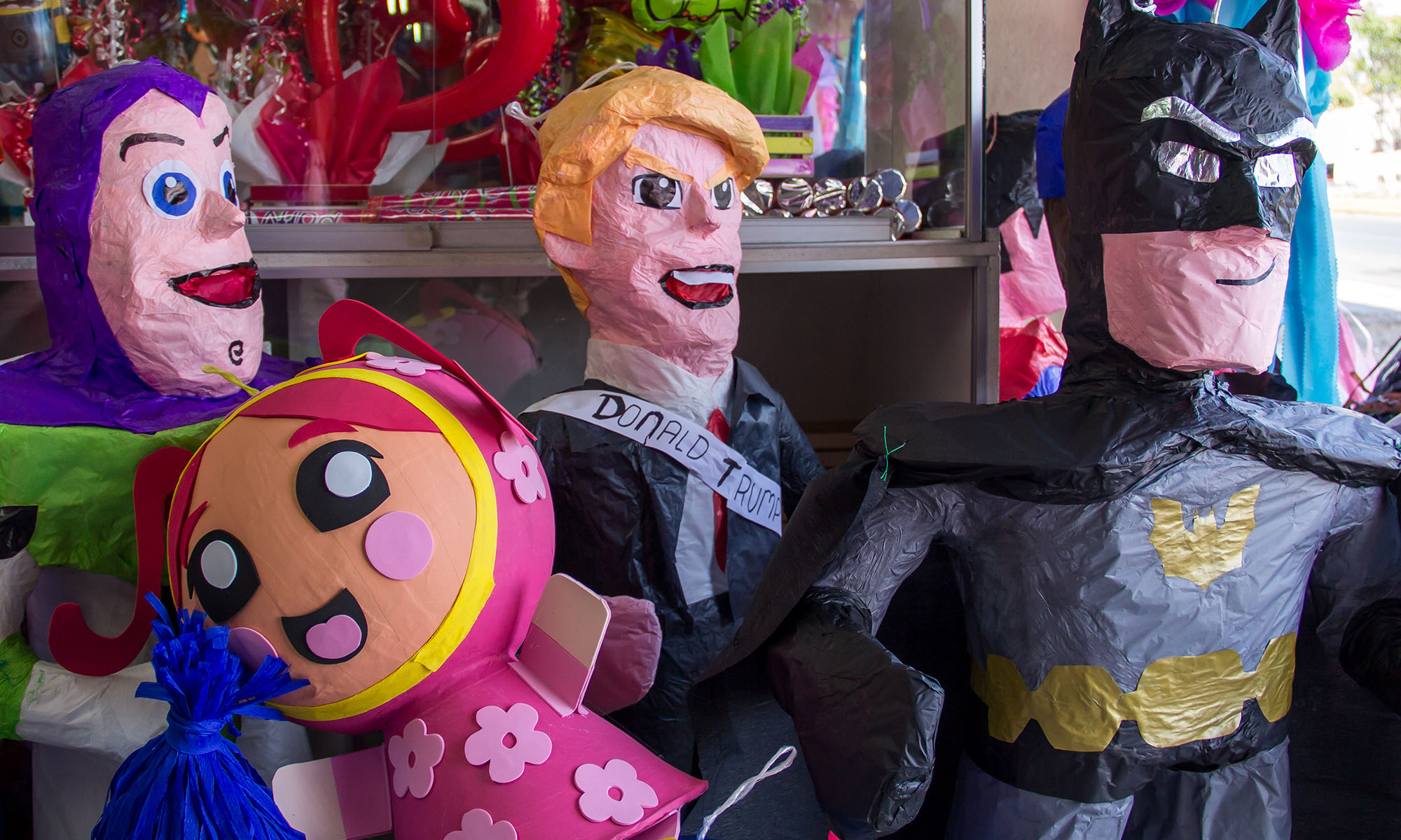 A Donald Trump piñata keeps curious company in Globo Kimba, Javier Velazquez’s piñata shop.