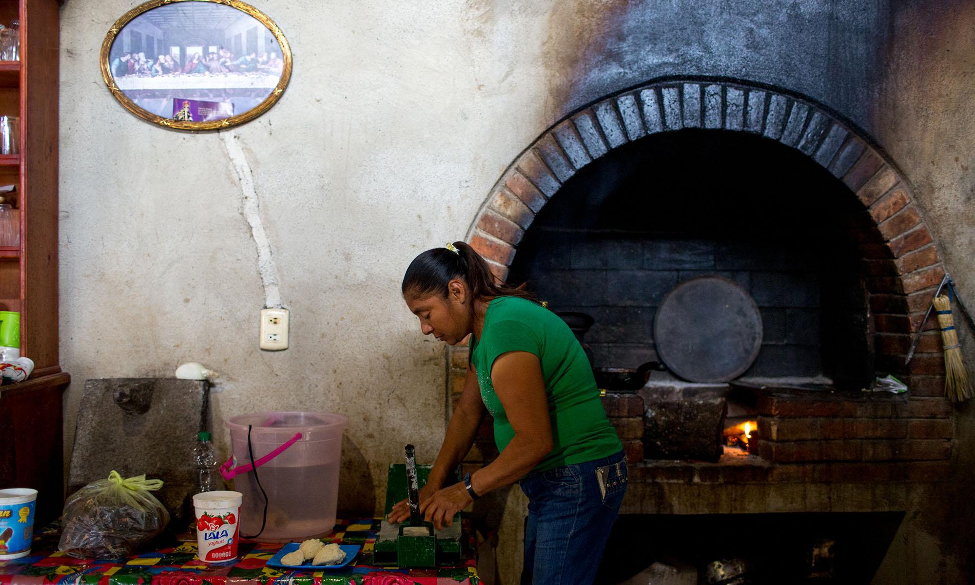 Martinez makes tortillas in her kitchen. Since her daughters no longer help support her in Tancama, Mexico - an area with few job opportunities - she works as a chef for tourists in a nearby eco-lodge. Martinez doesn't remember when her children left to find work in the U.S., some time between five and 10 years ago. Because they are undocumented, they can’t find work easily. She said she hasn’t spoken to them in eight to 12 months. When asked if she missed her daughters she said, “Of course. A lot… I can’t see them here because they can’t come back and forth.” (Photo by Courtney Pedroza/Cronkite Borderlands Initiative)