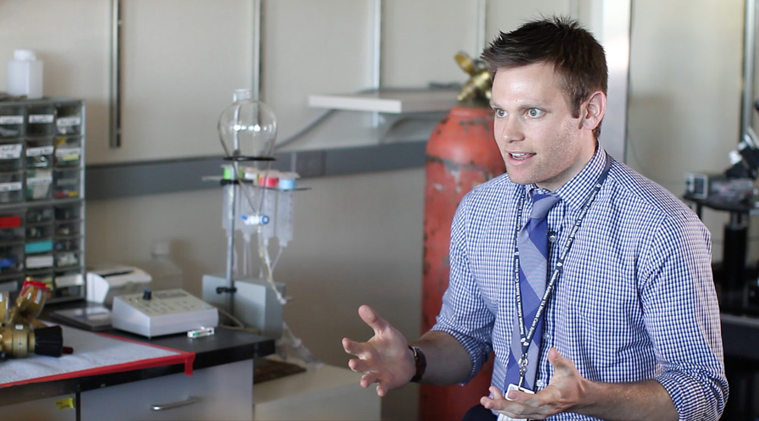 Alexander Sandweiss has spent the past five years studying how opioid drugs interact with the human body. He explains the process in the Vanderah lab at the University of Arizona’s Department of Pharmacology. (Photo by Cassie Ronda/Cronkite News)