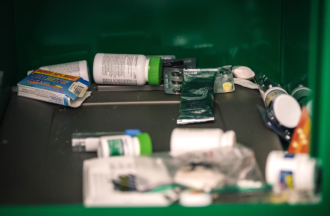 Phoenix police Officer Joe Bruno and his colleagues must empty the prescription drug drop-off bins once every month. However, he said they empty the bins about once every week because they receive too many medications to keep up. (Photo by Ryan Dent/Cronkite News)
