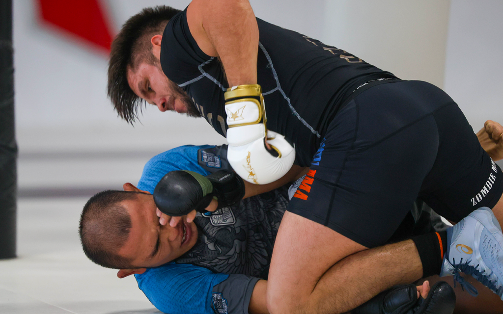 Cejudo hits a guy on the ground