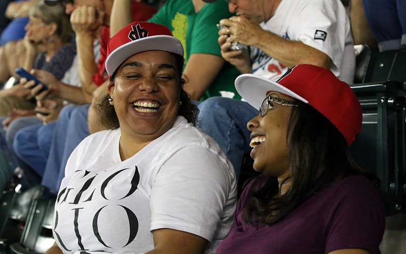 Jessica Dennis and Geriece Jenkins enjoy the September 11 Diamondbacks game. They attending the game because it was a college game night. (Photo by Kevin Jimenez/Cronkite News)