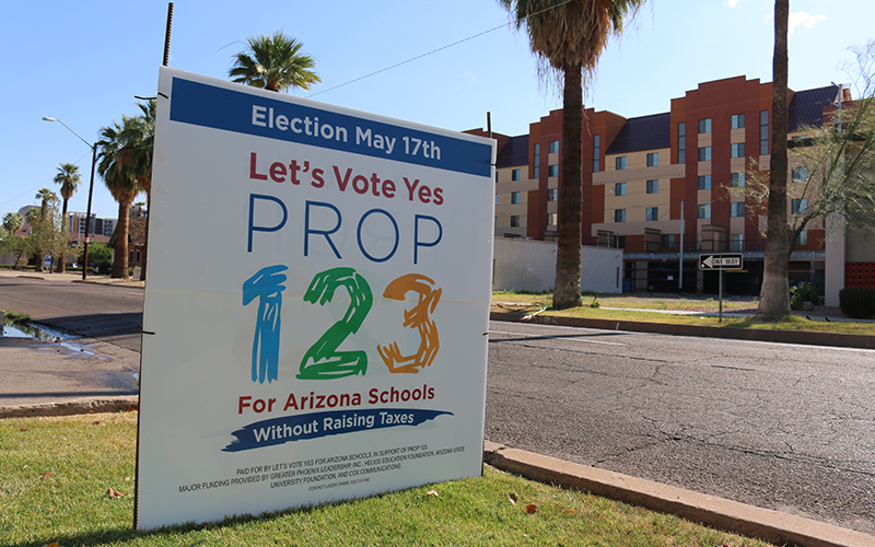 A sign showing support for Proposition 123 on the day of the special election.