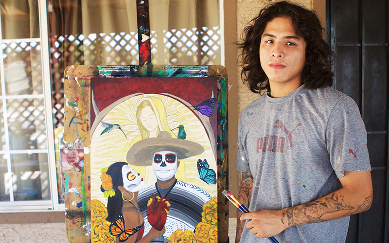 Guadalupe resident and artist Jose Lopez, 23, hasn't voted in previous elections. He says many of his fellow residents see no point to voting because nothing changes in his town. (Photo by Andres Guerra Luz/Cronkite News)