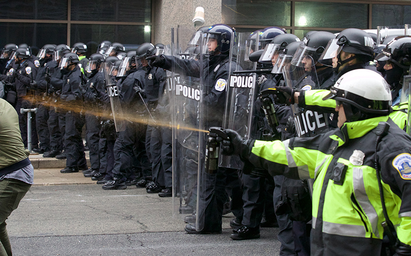 Resistance from the protesters results in counter-riot measures by the police. (Photo by Dustin Quiroz/Cronkite News)
