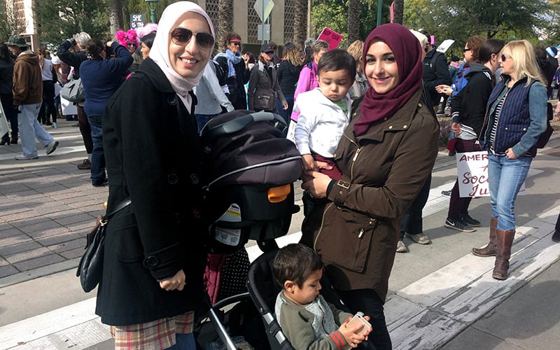 Best friends Rawa Awad, 29, and Nadia El-Hillal, 29, attended the march with El-Hillal's sons to 