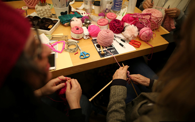 Knitters take part in the Pussyhat social media campaign to provide pink hats for protesters in the women's march in Washington, D.C., the day after the presidential inauguration, in Los Angeles