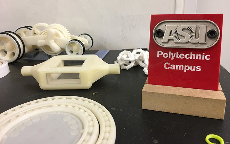 3-D printer items and sign that says ASU Polytechnic Campus