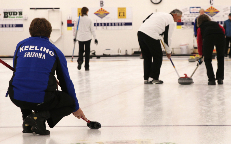 Sean Keeling watches his curling stone head down the ice during the Canada Week Bonspiel at Coyotes Curling Club, Friday, February 3, 2017 in Tempe, AZ. (Shane DeGrote/Cronkite News)