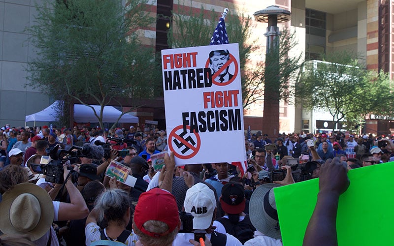 Fight Hatred Sign in Crowd