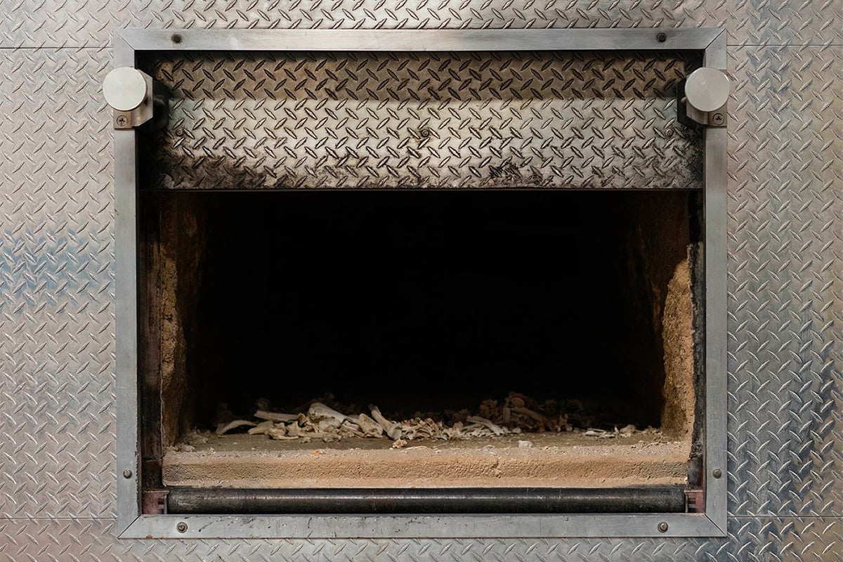 Cremated remains lie in the incineration chamber at the Paradise Memorial Crematory in Scottsdale, one of the state’s largest. Partly fueled by the pandemic, the U.S. cremation rate reached 56% in 2020; it was 67% in Arizona. (Photo by Kevin Pirehpour/Cronkite News)
