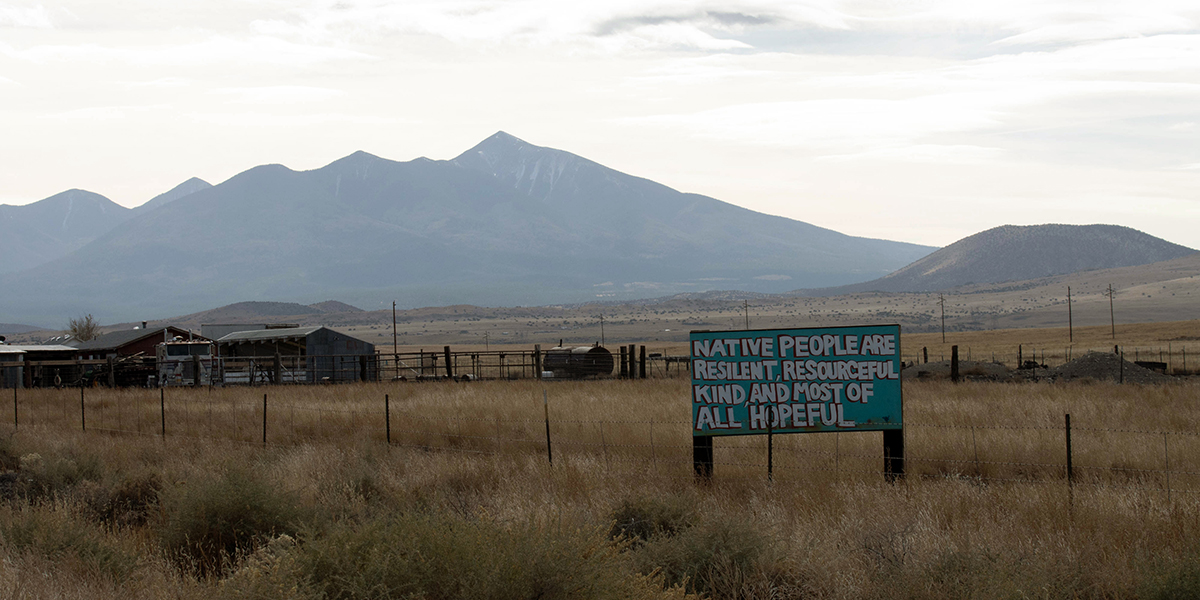 A newer addition to the timeless landscape of the Navajo Nation is a series of turquoise signs along southbound U.S. 89 near Tuba City. (Photo by Sierra Alvarez/Cronkite News)
