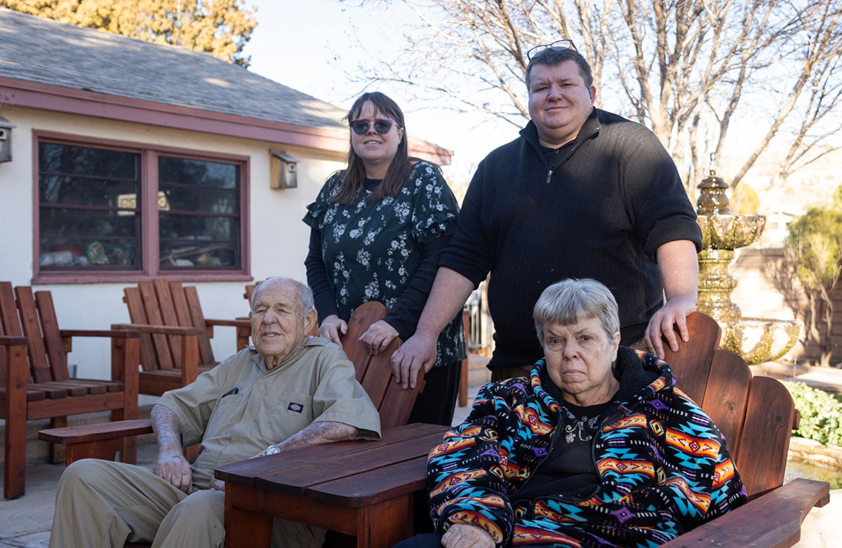 Eddie Pattillo and his wife, Mary Jane Pattillo, pose with their two children, Kim and Cullin Pattillo, at their home in Kingman on Feb. 3. Eddie has had cancer twice, and Mary Jane, Kim and Cullin have thyroid issues. (Photo by Monserrat Apud /Cronkite News)
