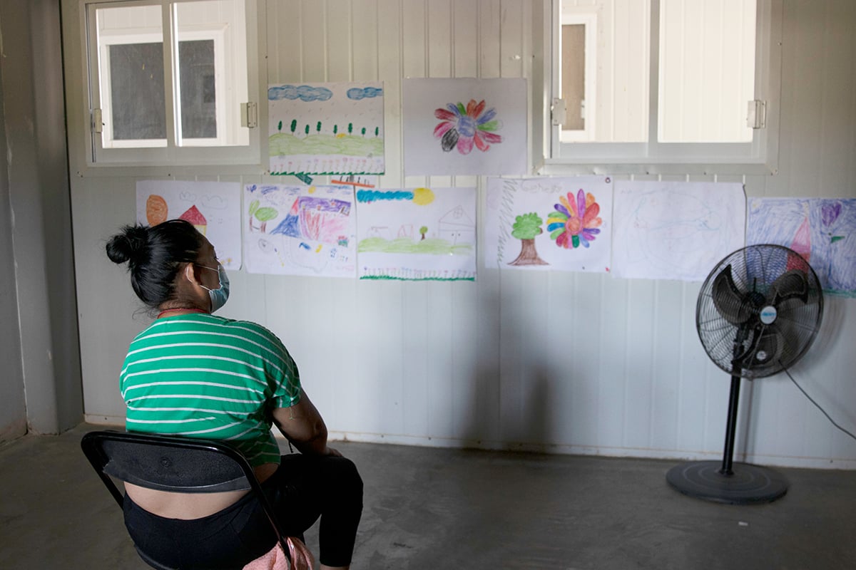 SYH, 42, from El Salvador, sits at Hospitalidad y Solidaridad shelter in Tapachula, Mexico, on March 5. Her full name is being withheld for her protection. Shelters have been at the forefront of providing much-needed mental health services for migrants. (Photo by Laura Bargfeld/Cronkite Borderlands Project)

