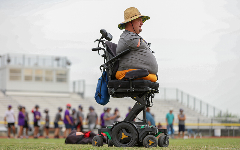 Wickenburg assistant coach Carter Crosland’s presence at practice and games inspires his players on the football field. (Photo by Grace Edwards/Cronkite News)