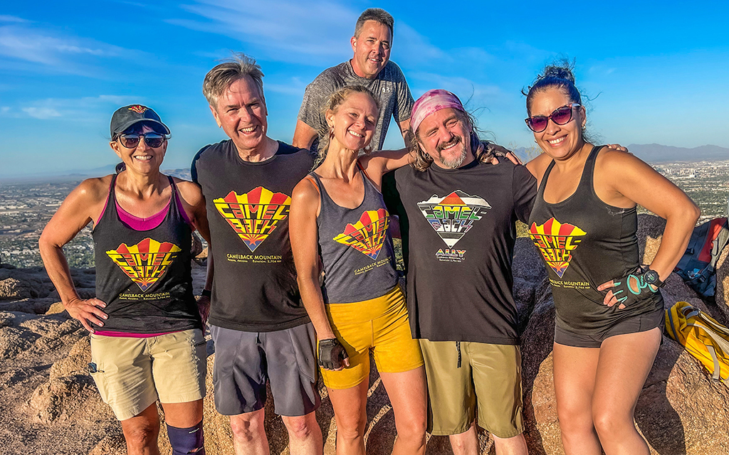 Hikers take a break at the top of Camelback Mountain in Phoenix on August, 2022. From left to right: Heidi McNeil, Seeley James, Jes Dobbs. Kevin Hunt stands behind Dobbs followed by Ron Harper and Erika Castro. (Photo courtesy of Jes Dobbs/Camelback Culture)
