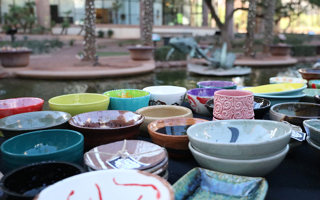 A mix of colorful handcrafted bowls are set up at the Arizona Center in downtown Phoenix for the Empty Bowls event hosted by the Waste Not Arizona on Oct. 14, 2022. (Photo by Scianna Garcia/Cronkite News)