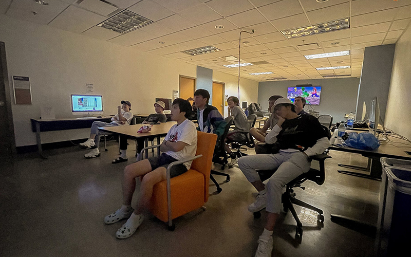 Former Arizona State League of Legends player Sean Innes, left, here watching an international tournament with the ASU team, has transitioned to head coach. (Photo courtesy ASU League of Legends)