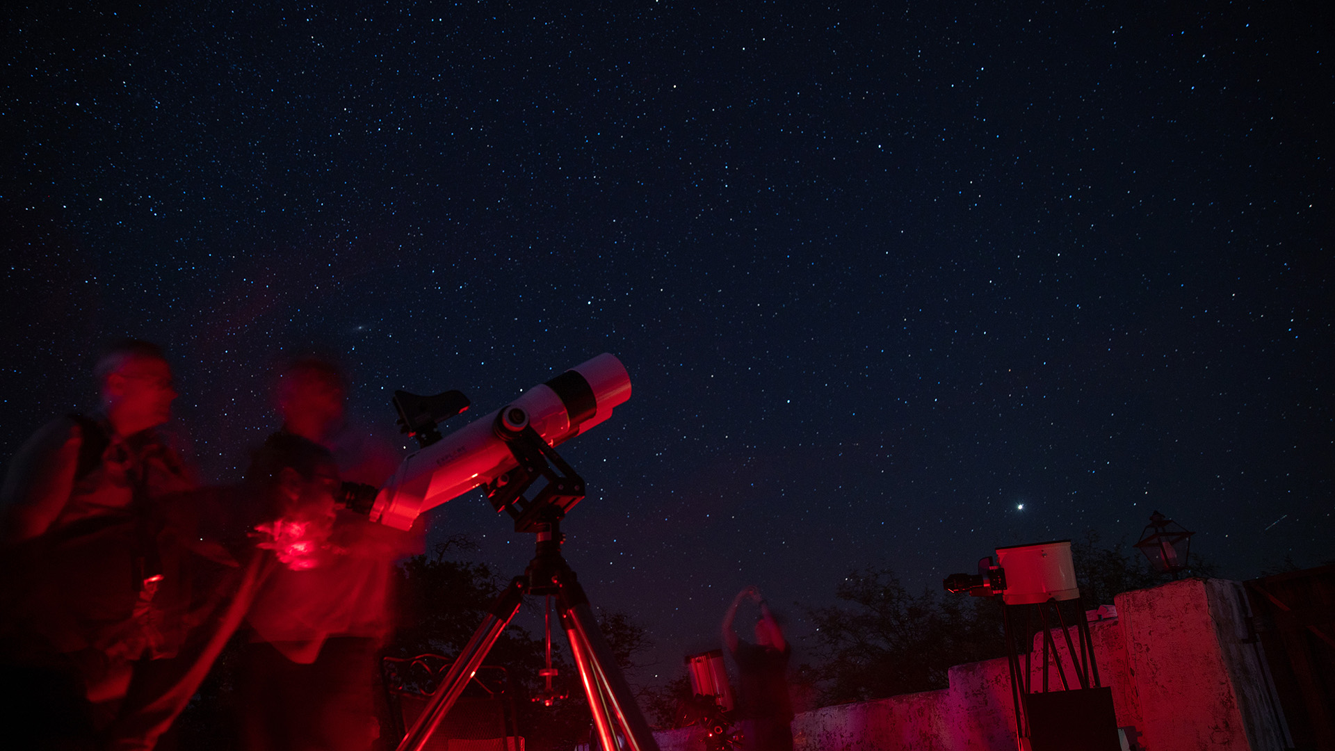 Spectators look through an Explore Scientific telescope at Oracle State Park north of Tucson on Sept. 24, 2022. Explore Scientific hosted a weeklong star party and dark-sky event in Oracle. (Photo by Drake Presto/Cronkite News)
