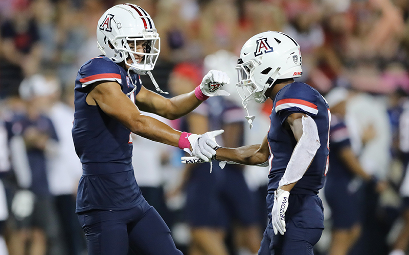Arizona’s wide receivers, including Tetairoa McMillan, left, and Dorian Singer, have plenty to celebrate after a strong showing by the unit against Colorado Saturday. (Photo by Rebecca Noble/Getty Images)