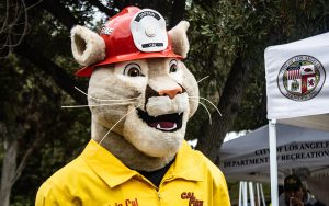 Capt. Cal, mascot of the California Department of Forestry and Fire protection, attends P-22 Day, which honors an aging mountain lion living in and near Griffith Park in LA. (Photo by Emeril Gordon/Cronkite News)