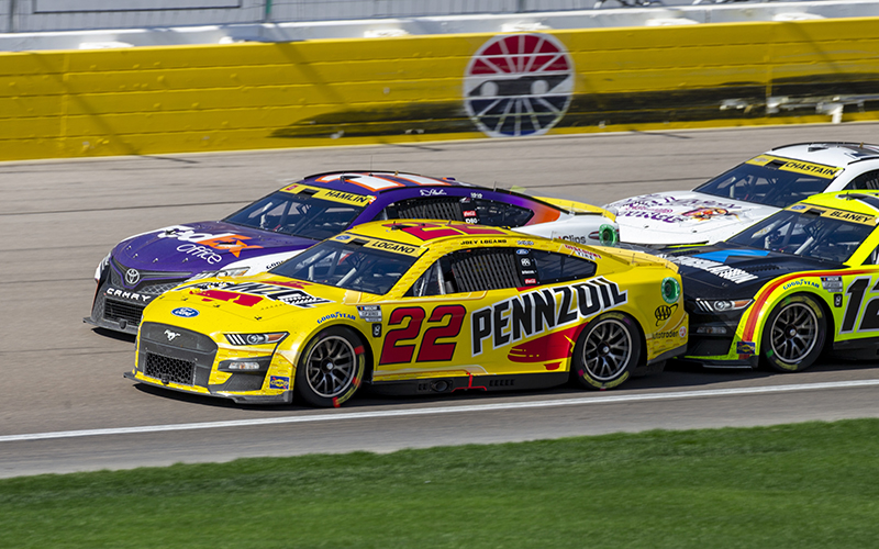 Joey Logano and his 22 car are nudged by Ryan Blaney during a restart of the NASCAR Cup Series Playoff South Point 400 at Vegas Motor Speedway. Logano won and secured an automatic berth in the championship race Nov. 6 at Phoenix Raceway. (Photo by Larry Placido/Icon Sportswire via Getty Images)