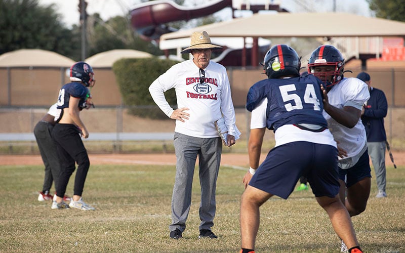 Centennial football coach Richard Taylor watches over his team as it prepares for an anticipated matchup Friday against undefeated Liberty. (Photo by Brooklyn Hall/ Cronkite News)