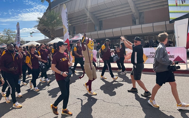 Fans enjoy the the Sun Devil Walk, which features players walking outside Desert Financial Arena en route to Sun Devil Stadium. (Photo by Aayush Gupta/Cronkite News)