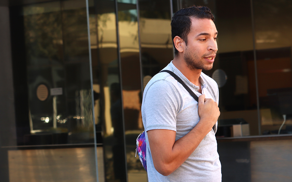 Daniel Ruiz, 28, of Glendale, said a poll watcher confronted him shortly after he dropped off his ballot at Glendale Community College. Ruiz said he felt intimidated and thrown off by the experience. (Photo by Omar Waheed/Special for Cronkite News)