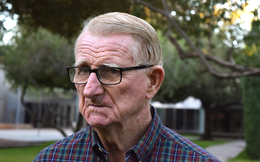 Don Newton stands outside the Phoenix Art Museum in downtown Phoenix on Tuesday. Newton was the first person to arrive to the polling location, casting the first ballot of the day. (Photo by Albert Serna Jr./Special for Cronkite News)