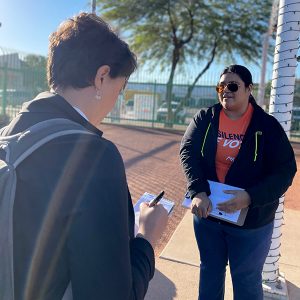 Jessica Aguilar, a volunteer with Native Vote, assists voters if there is a problem. The organization is nonpartisan and aims to help and education voters. (Photo by JaMirah Borden/Special for Cronkite News)