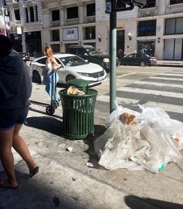 Trash piles up on a Los Angeles street corner. The city has mountains of trash on sidewalks, streets and gutters. (Photo by Fernanda Galan Martinez/Cronkite News)