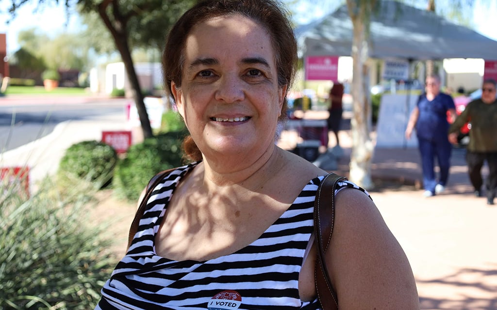 Nilda Candalario, 62, drops her ballot off at Surprise City Hall on Nov. 8. Since she was a child living in Puerto Rico, Candalario has kept her family’s tradition of going to the polls in person on Election Day. (Photo by Chad Bradley/Special for Cronkite News)