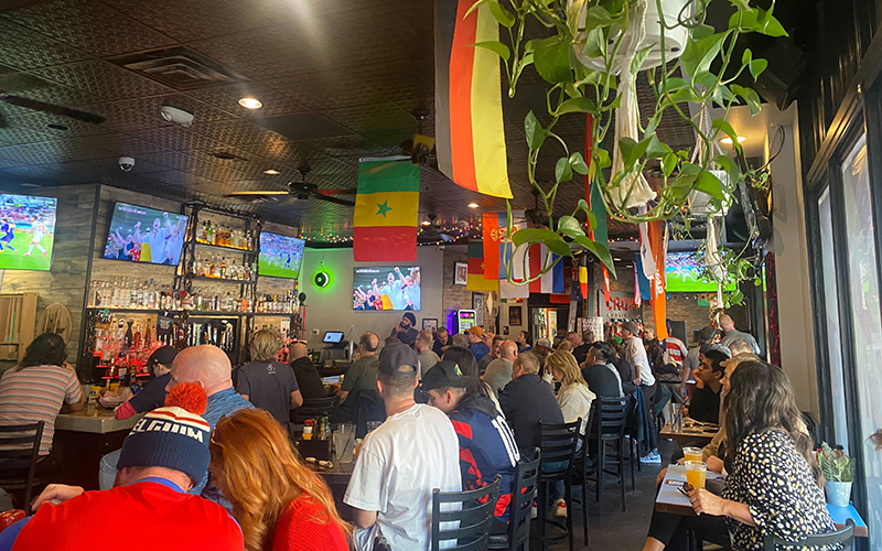 Soccer fans at Crown Public House in downtown Phoenix watch the World Cup match between the United States and Iran. Controversy has surrounded the competition. (Photo by Nikash Nath/Cronkite News)