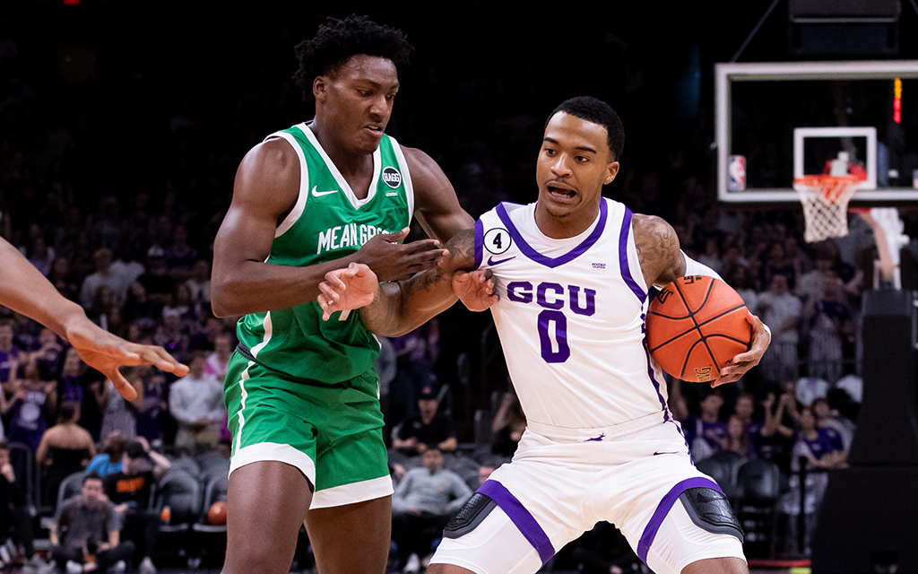 North Texas forward Aaron Scott, left, and Grand Canyon guard Ray Harrison fight for possession during the Jerry Colangelo Classic Saturday at Footprint Center. GCU lost on a last-second shot. (Photo by Zac BonDurant/Icon Sportswire via Getty Images)