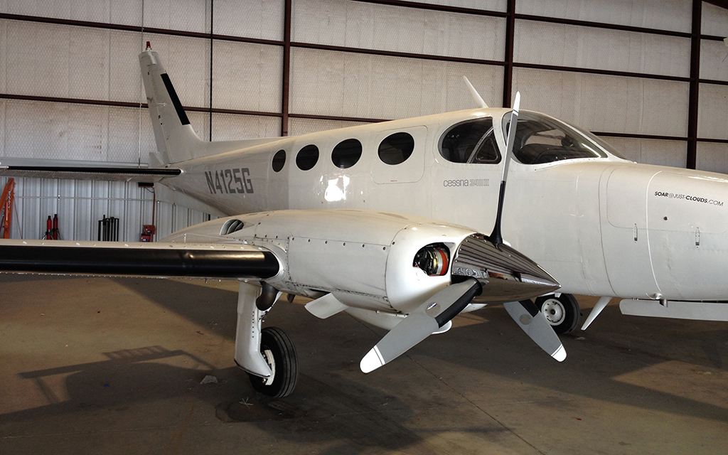 A turboprop Piper PA31T Cheyenne II airplane sits in storage. These twin-engine airplanes carry both hygroscopic and glaciogenic flares to use for cloud seeding. (Photo courtesy of Gary Walker/SOAR)