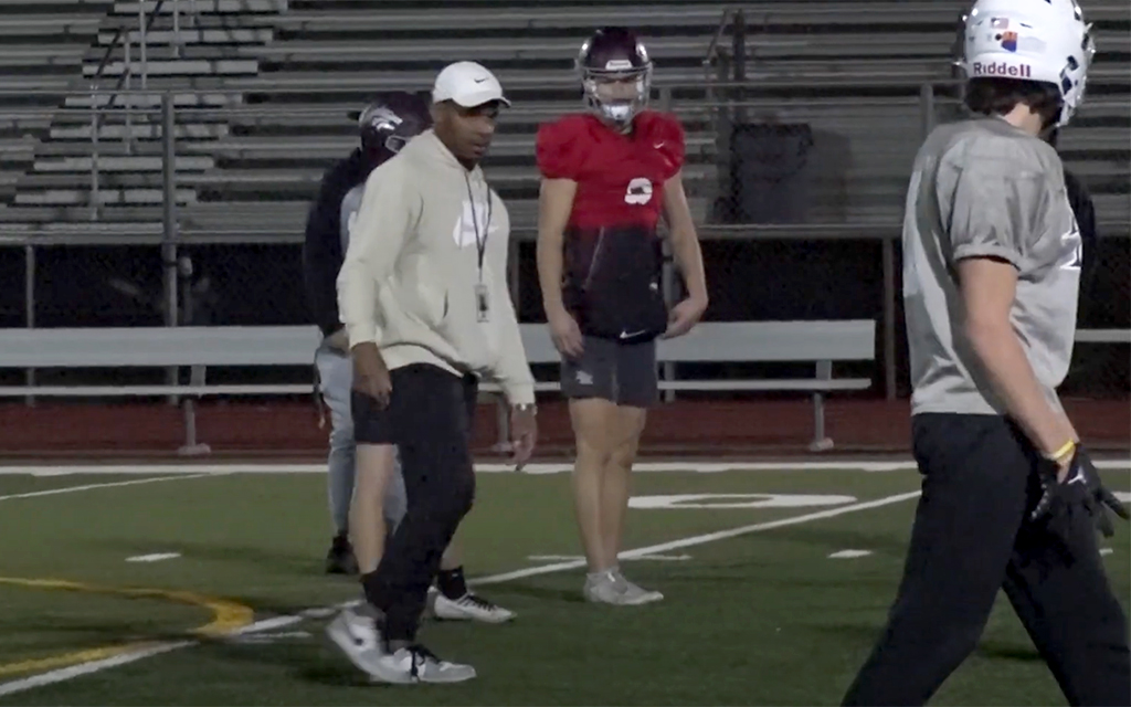 Conrad Hamilton played six seasons for the New York Giants and Atlanta Falcons, equipping him with the tools to turn the Desert Mountain football program into a powerhouse as head coach. (Screen grab via Cronkite News video)