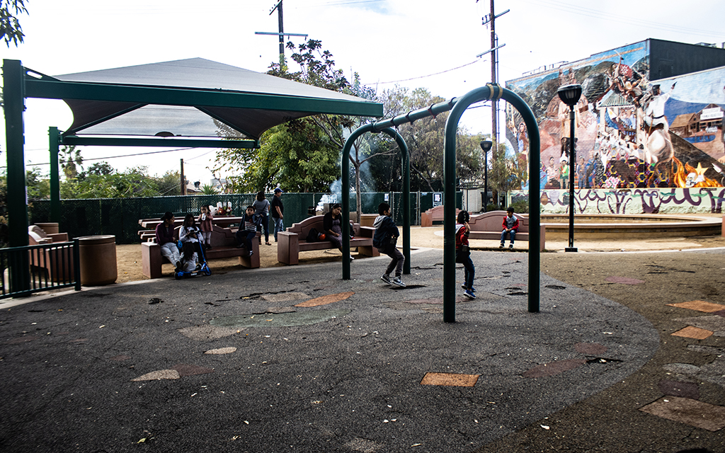 Children try out the swings in Unidad Park in Los Angeles' Unidad Park, situated in the Historic Filipinotown section of the city, in this photo taken Nov. 21, 2022. (Photo by Emeril Gordon/Cronkite News)