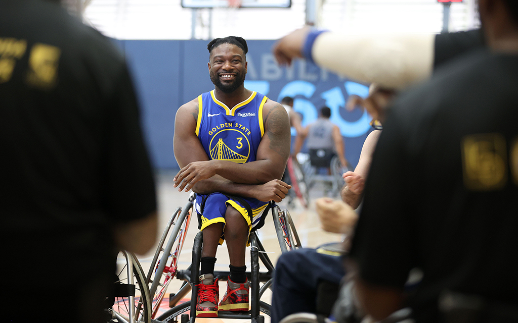 During their pregame huddle, Golden State Road Warriors player Matt Scott laughs with his teammates. It was the Warriors' second game of the day at the 23rd Annual D1 Phoenix Invitational at Ability360 in Phoenix Jan. 28, 2023. (Photo by Brooklyn Hall/Cronkite News)