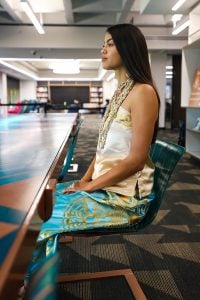 Lourdes “Lulu” Pereira wears a Hia-Ced O’odham ribbon skirt with the tribe’s seal at the Hayden Library at ASU in Tempe on Dec. 1, 2022. (Photo by Campbell Wilmot/Cronkite News)