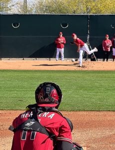 Diamondbacks reliever Blake Walston throws a pitch to catcher Jose Herrera so hard that his hat nearly falls off. (Photo by Brevin Monroe/Cronkite News)