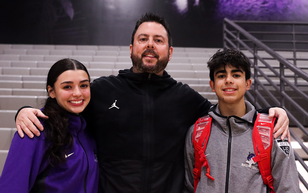 Basketball has always been a part of the lives of Ty Amundsen, center, and his children Mia, left, and J.T. (Photo by Haley Smilow/Cronkite News)