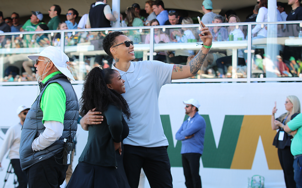 The WM Phoenix Open had the attention of the golf world, with a $20 million purse and a fan base that prompted the tournament to sell out Friday and Saturday. Among those who attended was Brittney Griner, right, and her wife, Cherelle, were among those who watched the sport’s best. (Photo by Matt Venezia/Cronkite News)