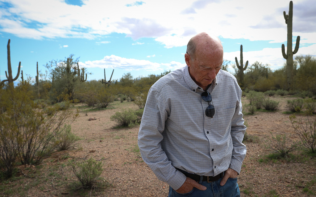 Tom Hannagan, Friends of Ironwood Forest board president, walks through Ironwood Forest National Monument on Jan. 31, 2023, in Tucson. (Photo by Evelyn Nielsen/Cronkite News)