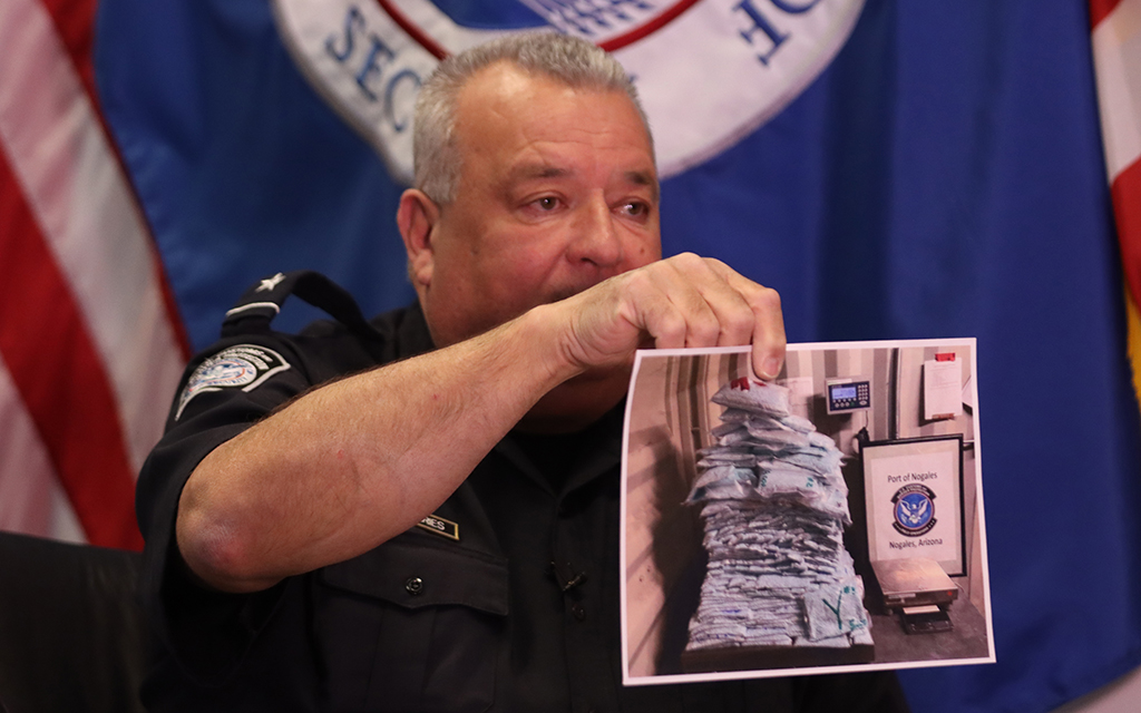 Michael Humphries, Customs and Border Protection area port director of the Port of Nogales, shows a photo on Jan. 26, 2023, of fentanyl seized at the port. (Photo by Logan Camden/Cronkite News)